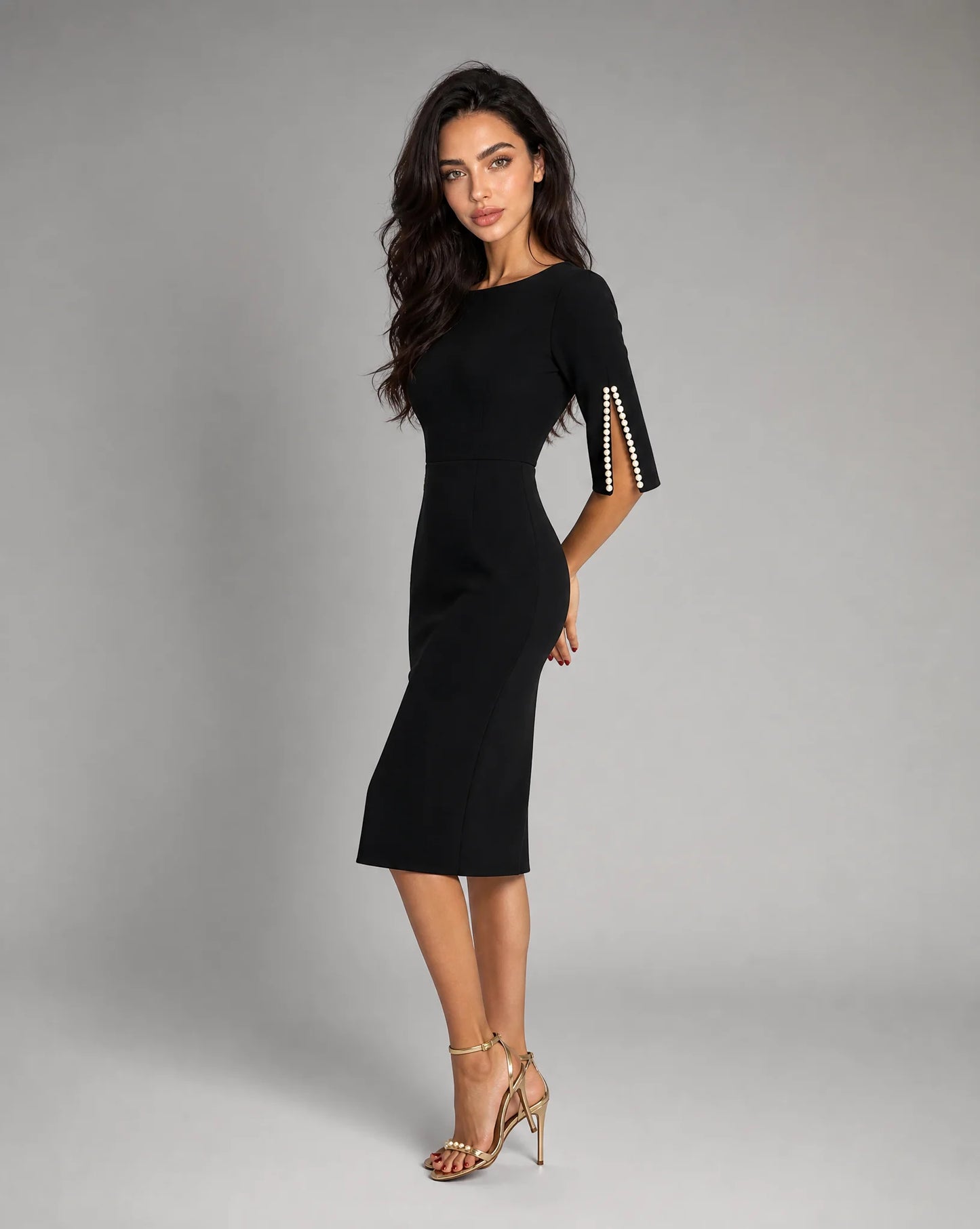 Women's black midi dress with pearl embellished sleeves and timeless evening style by ILYNORA