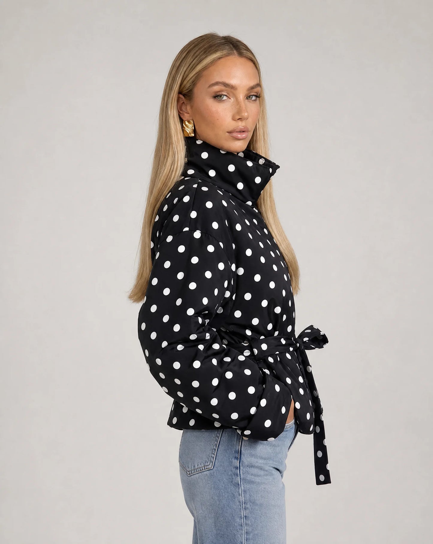 Women's black and white polka dot jacket with stand collar and flattering tailored silhouette by ILYNORA