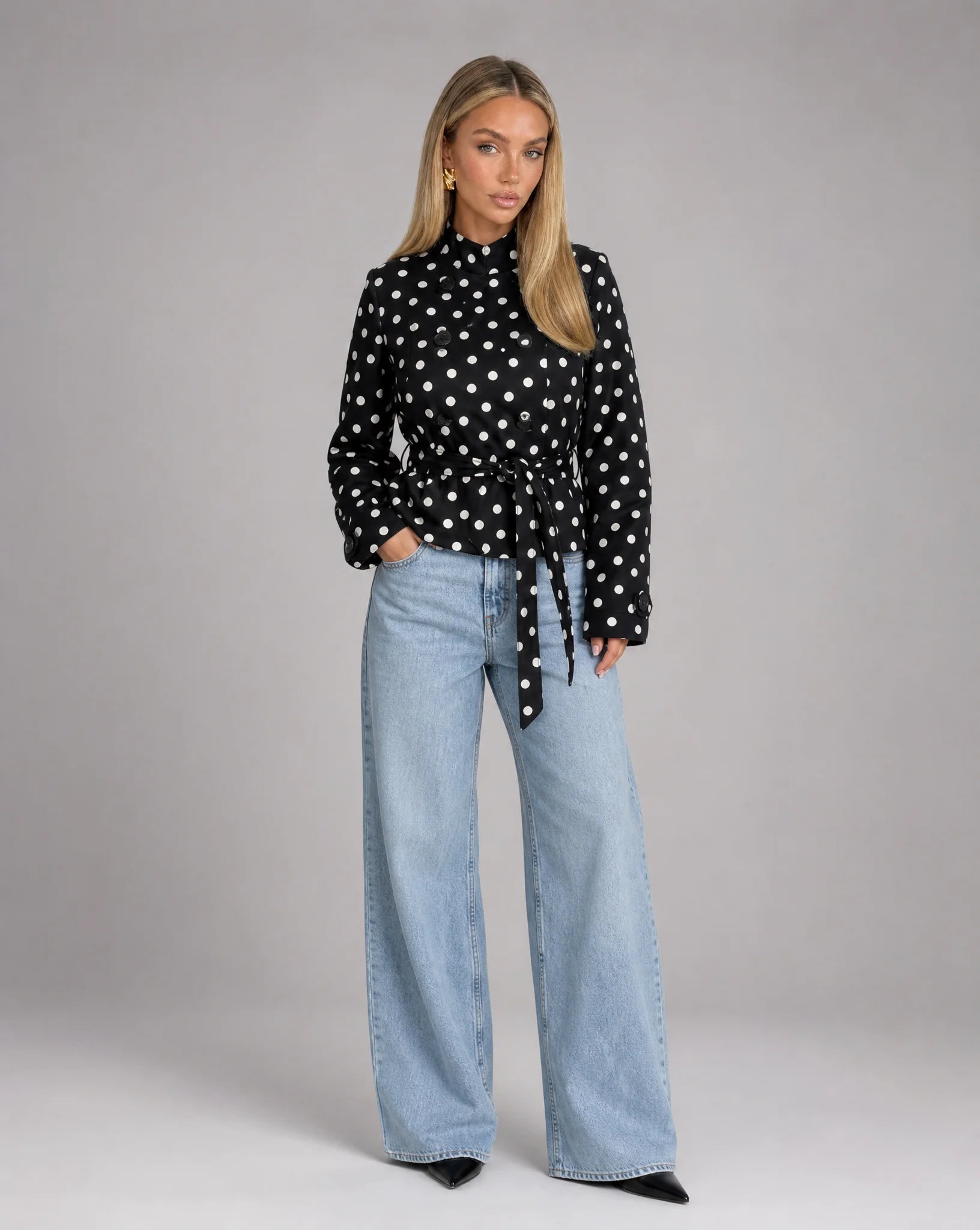 Women's black and white polka dot jacket styled with wide leg jeans and chic everyday look by ILYNORA