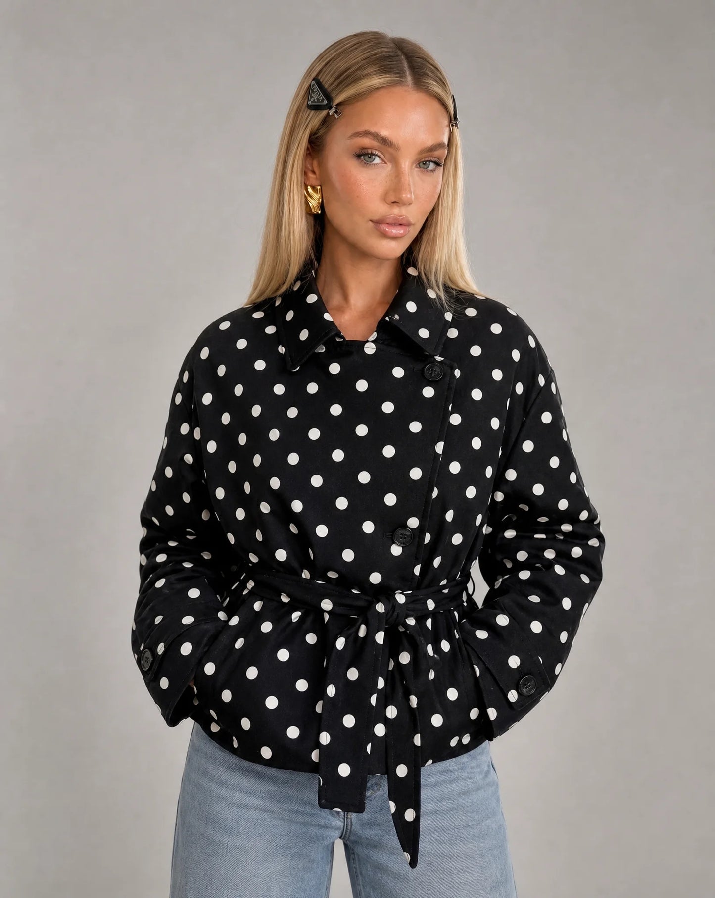 Women's black and white polka dot double breasted jacket with waist belt and vintage-inspired style by ILYNORA