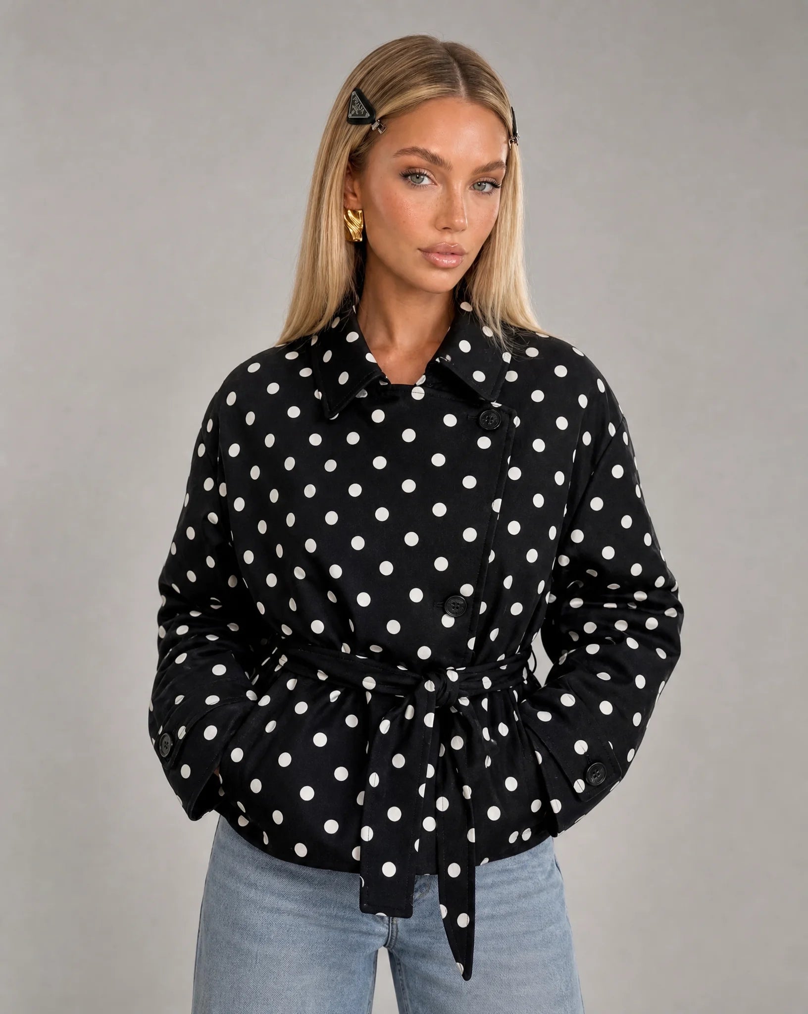 Women's black and white polka dot double breasted jacket with waist belt and vintage-inspired style by ILYNORA