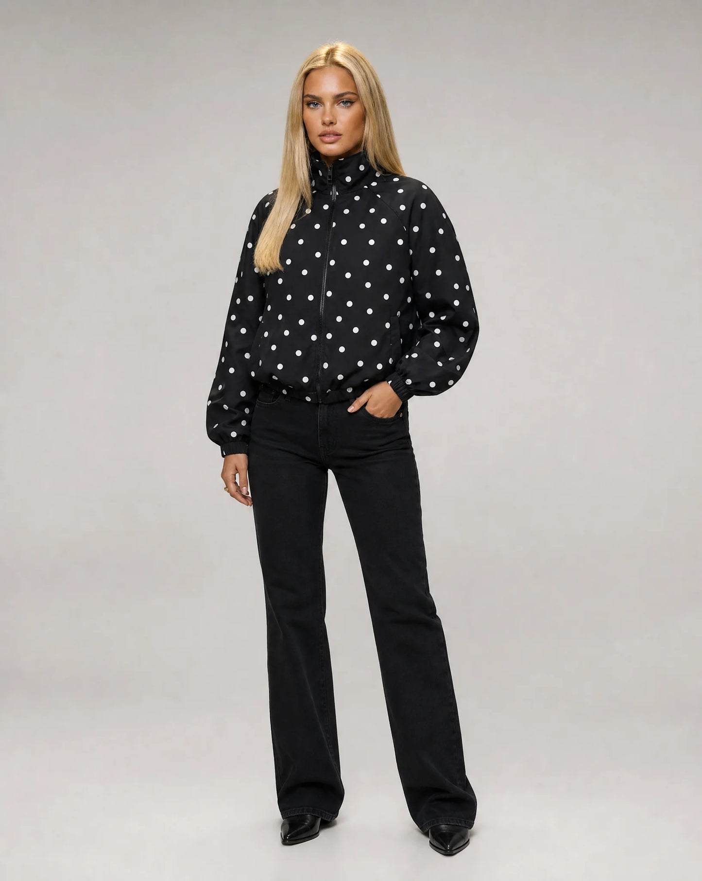 Women's black polka dot bomber jacket with oversized silhouette and modern casual look by ILYNORA