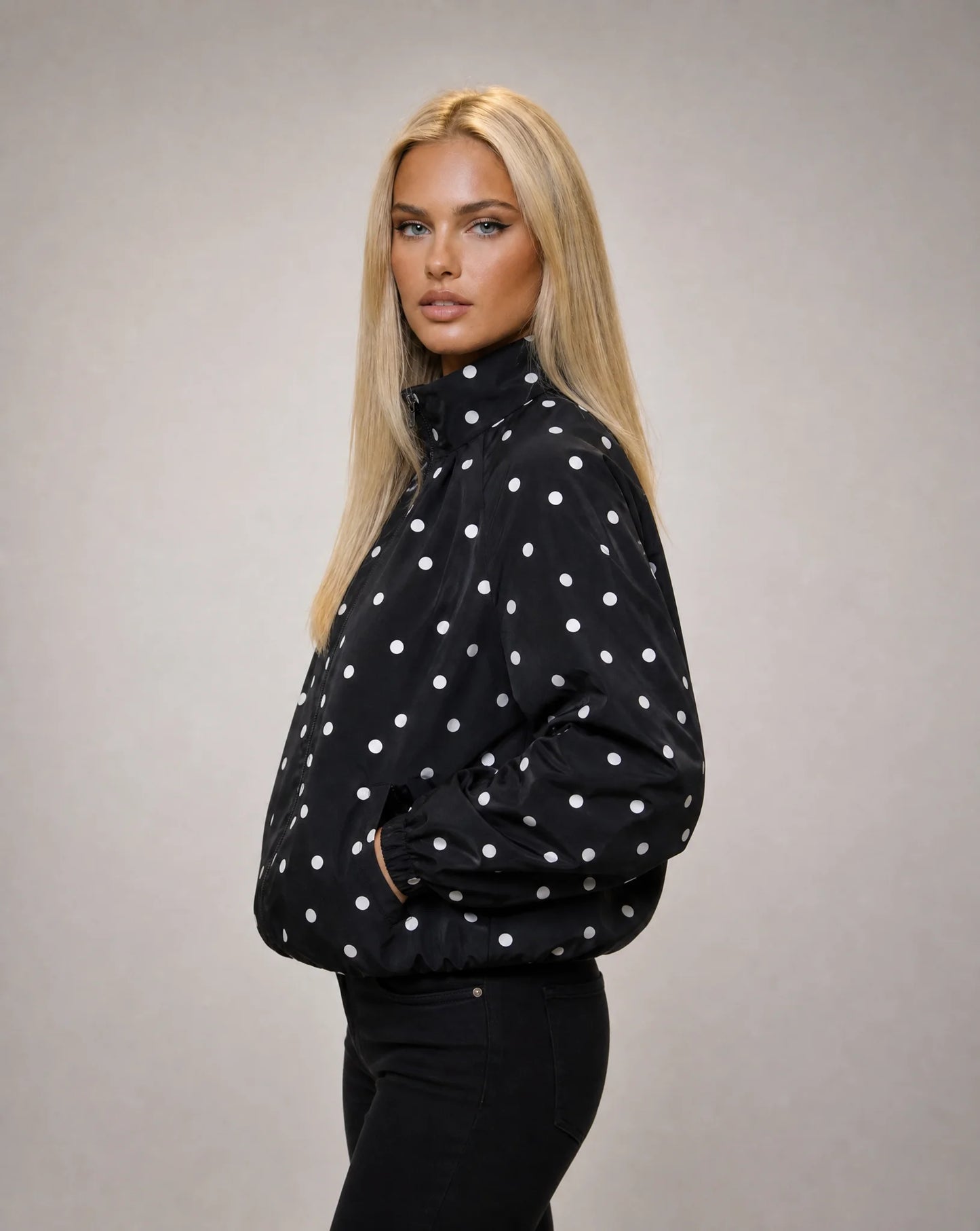 Women's black polka dot lightweight jacket with stand collar and versatile everyday styling by ILYNORA