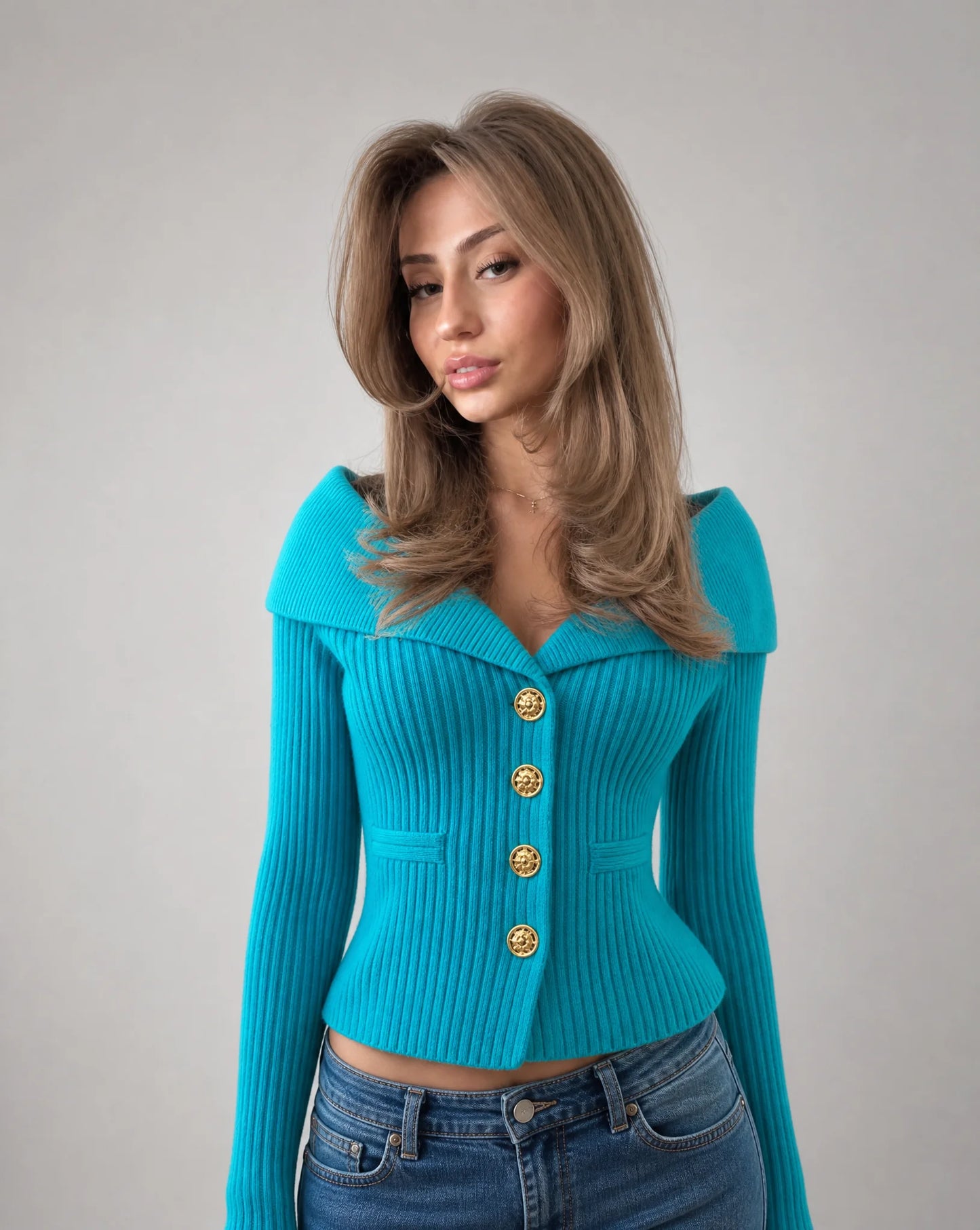 Blue ribbed off shoulder cardigan with fitted silhouette and gold button accents by ILYNORA