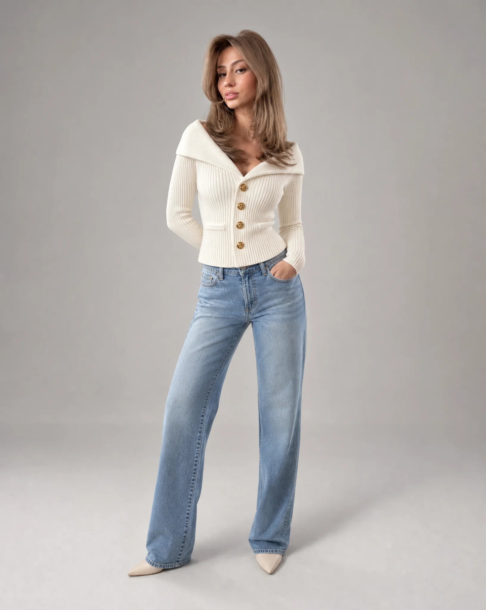 White ribbed off shoulder cardigan styled with denim jeans and gold button fastening by ILYNORA