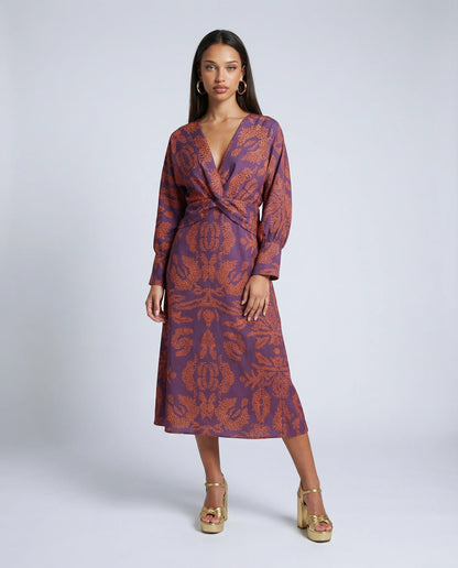 Women's satin knot midi dress in purple by Ilynora, front view with draped silhouette and knot waist detail