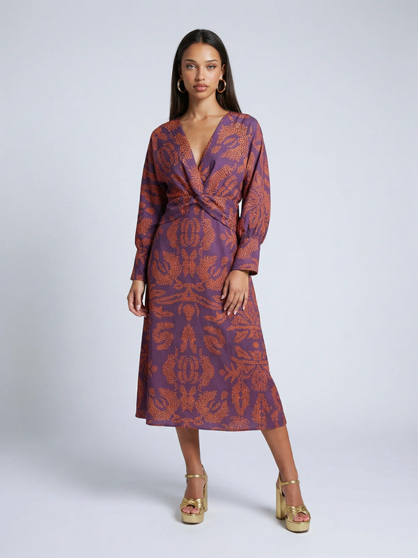 Women's satin knot midi dress in purple by Ilynora, front view with draped silhouette and knot waist detail