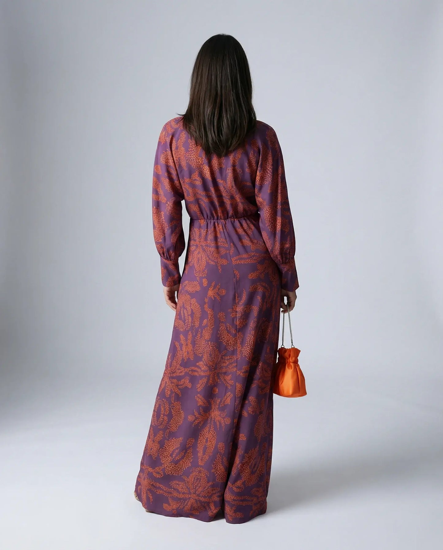 Purple satin midi dress by Ilynora, back view highlighting fluid fit and elegant movement