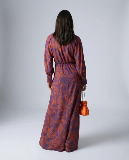Purple satin midi dress by Ilynora, back view highlighting fluid fit and elegant movement