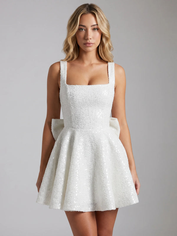 White sequin bow mini dress with square neckline and flared skirt for parties and celebrations by ILYNORA