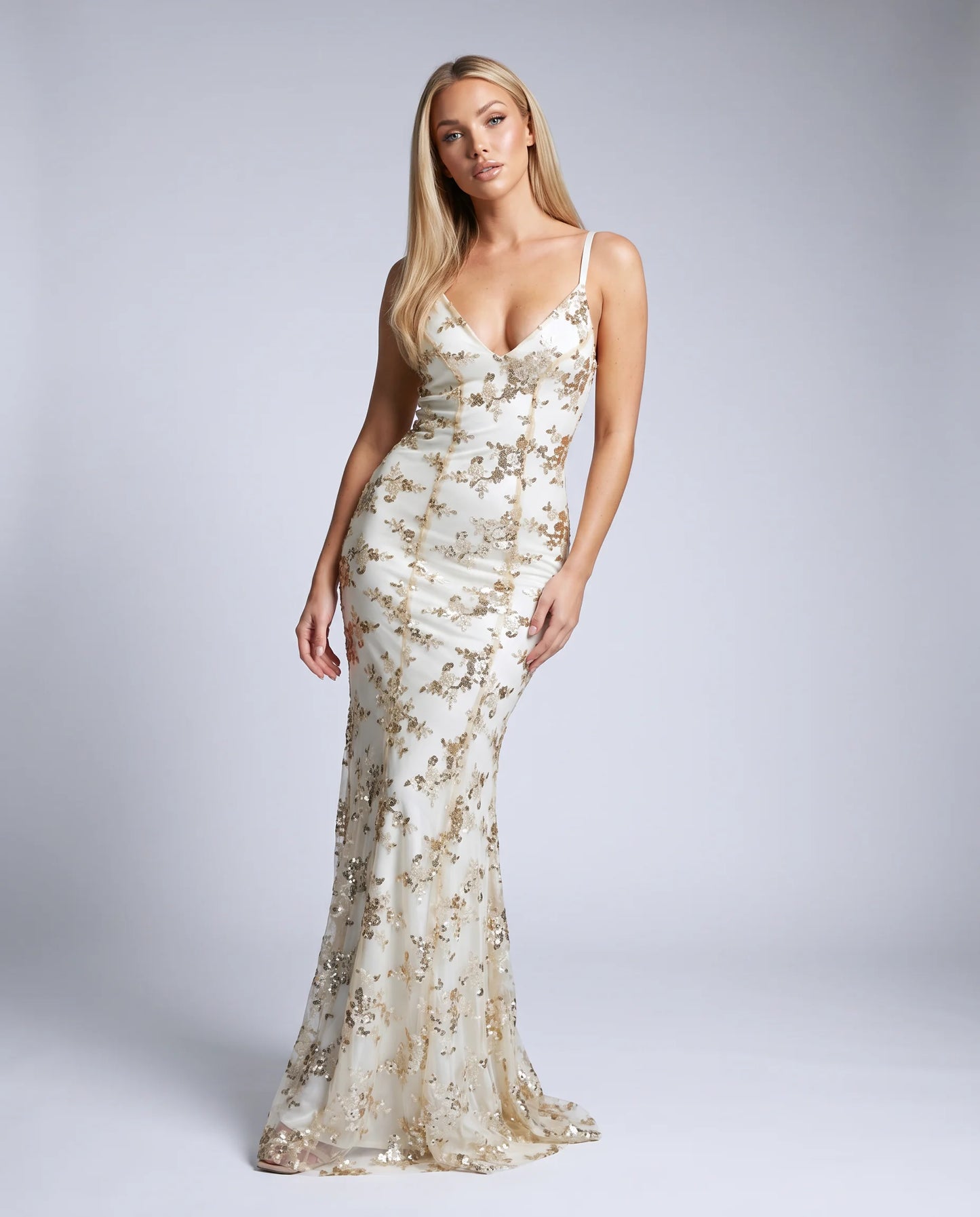 Apricot sequin evening maxi dress with floral embellishments and sophisticated gala styling by ILYNORA