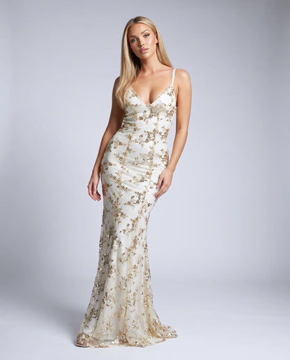Apricot sequin evening maxi dress with floral embellishments and sophisticated gala styling by ILYNORA
