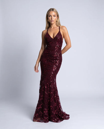 Wine red sequin evening maxi dress with elegant silhouette and statement formalwear styling by ILYNORA