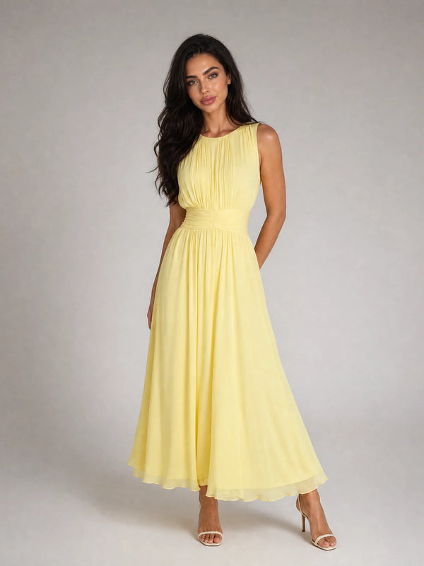Women's yellow sleeveless chiffon maxi dress with flowing silhouette and elegant summer styling by ILYNORA