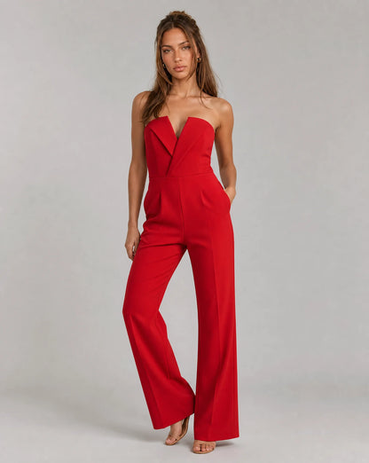 Red strapless wide leg jumpsuit with fitted bodice and statement occasion wear styling by ILYNORA