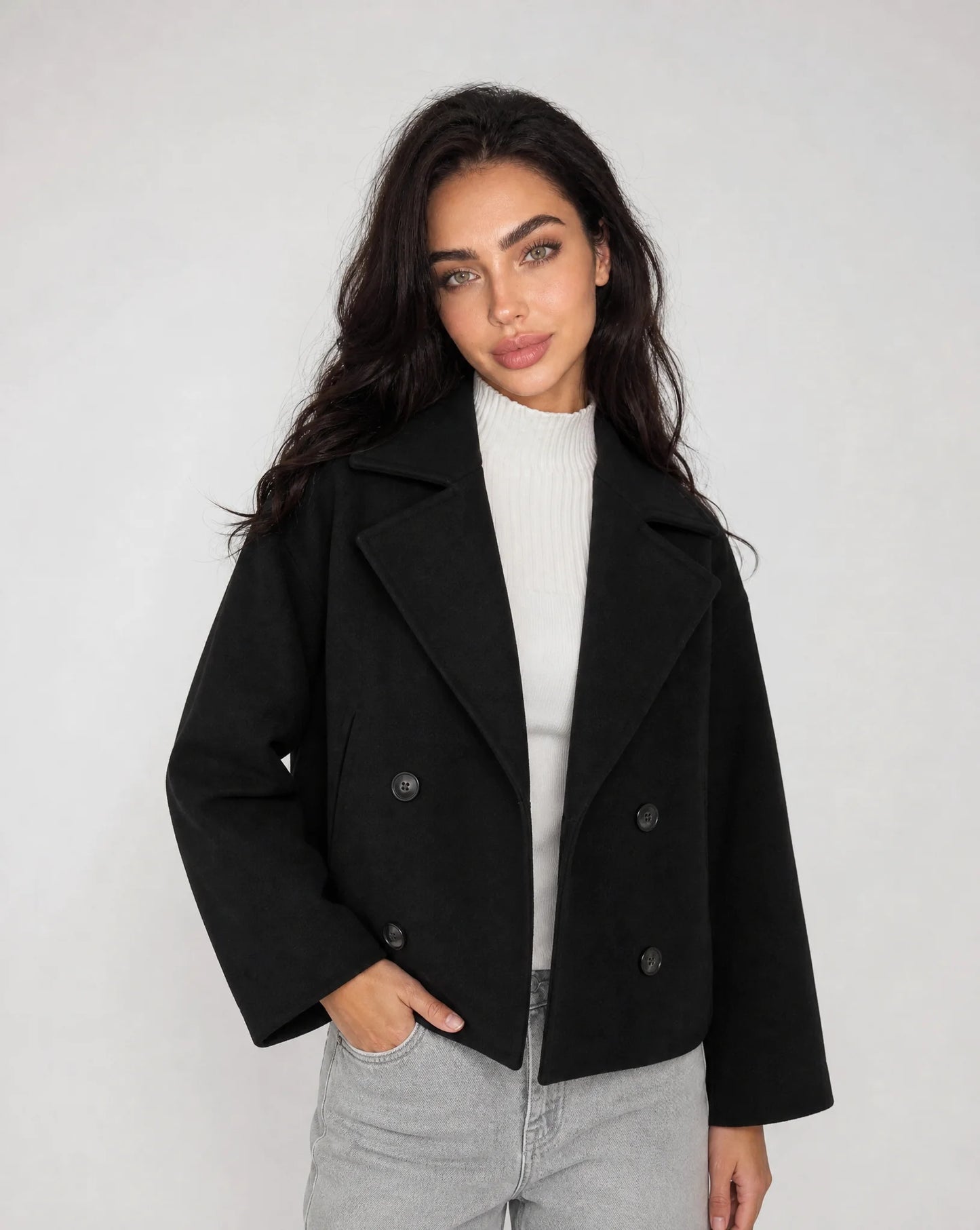 Black structured cropped blazer with tailored fit and sophisticated smart casual styling by ILYNORA