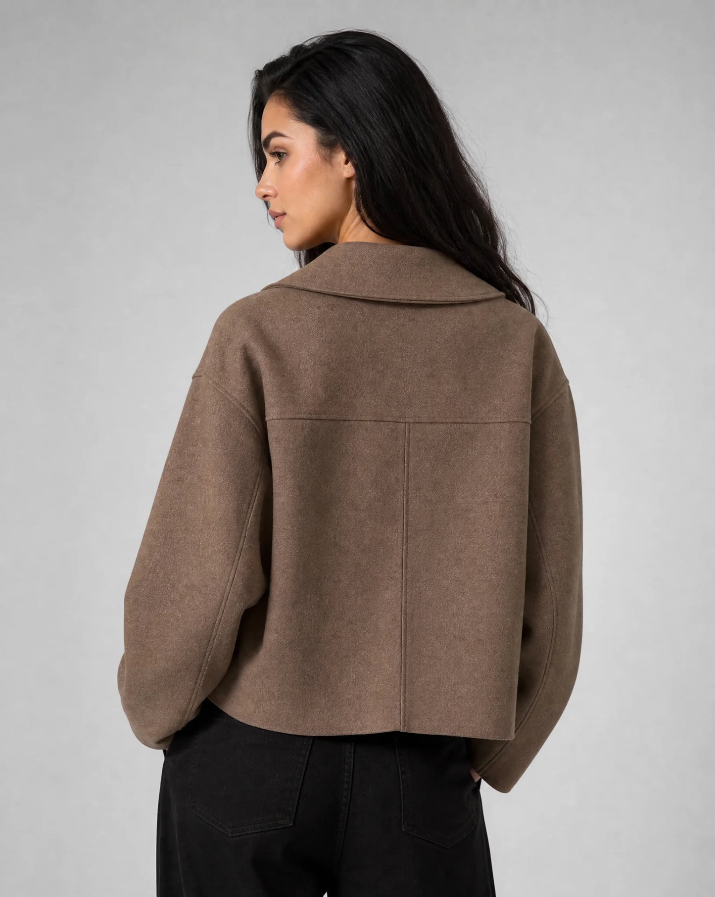 Brown structured cropped blazer side view with clean lines and elegant styling by ILYNORA