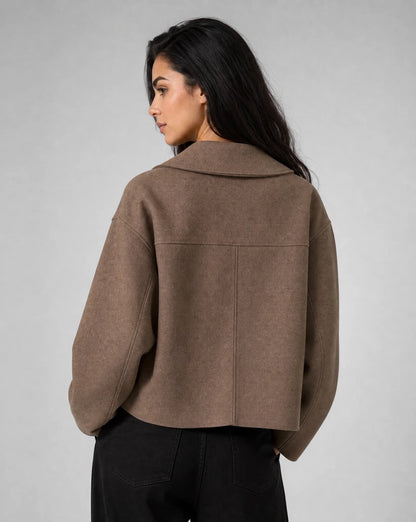 Brown structured cropped blazer side view with clean lines and elegant styling by ILYNORA