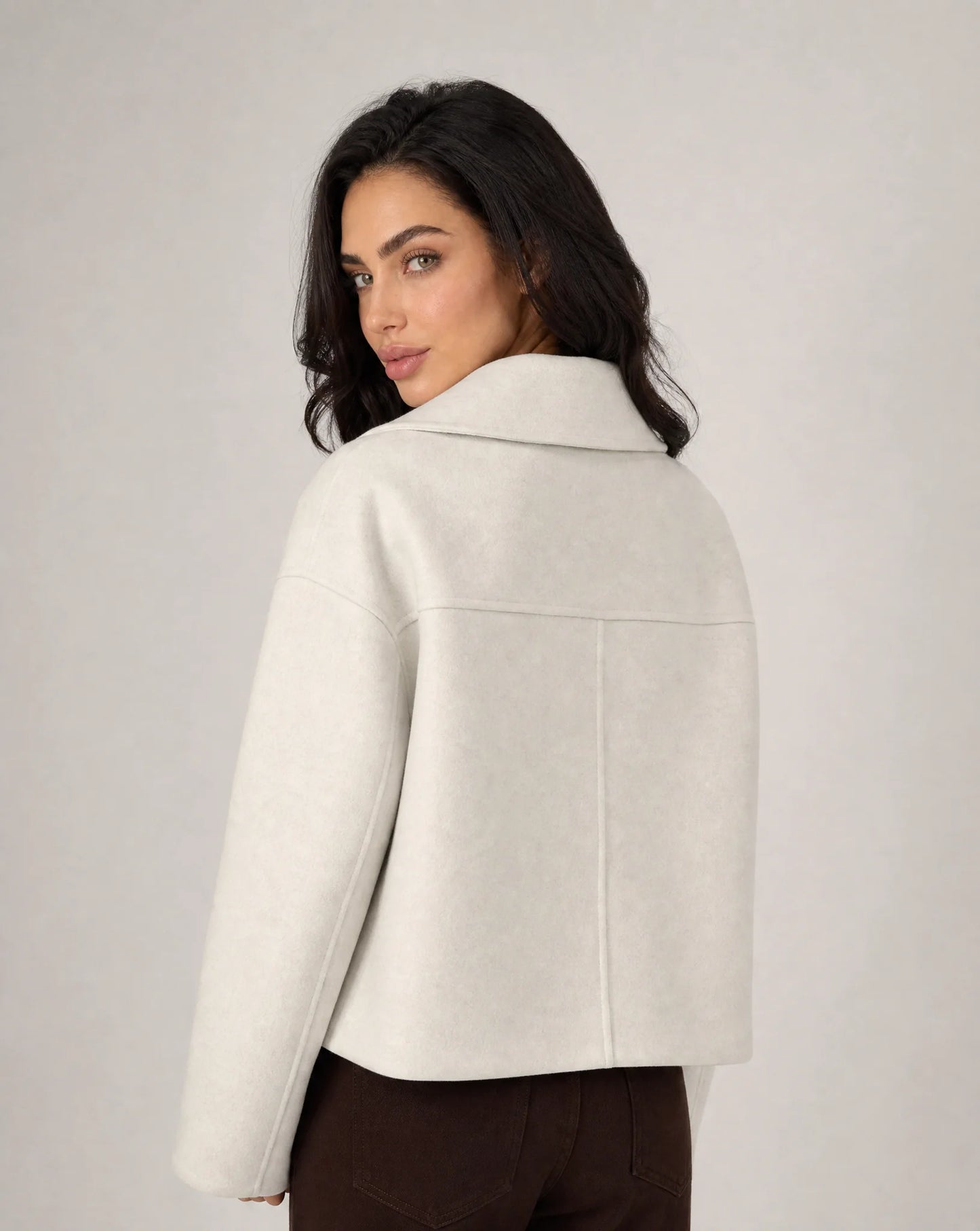 White structured cropped blazer side view with clean tailoring and polished silhouette by ILYNORA