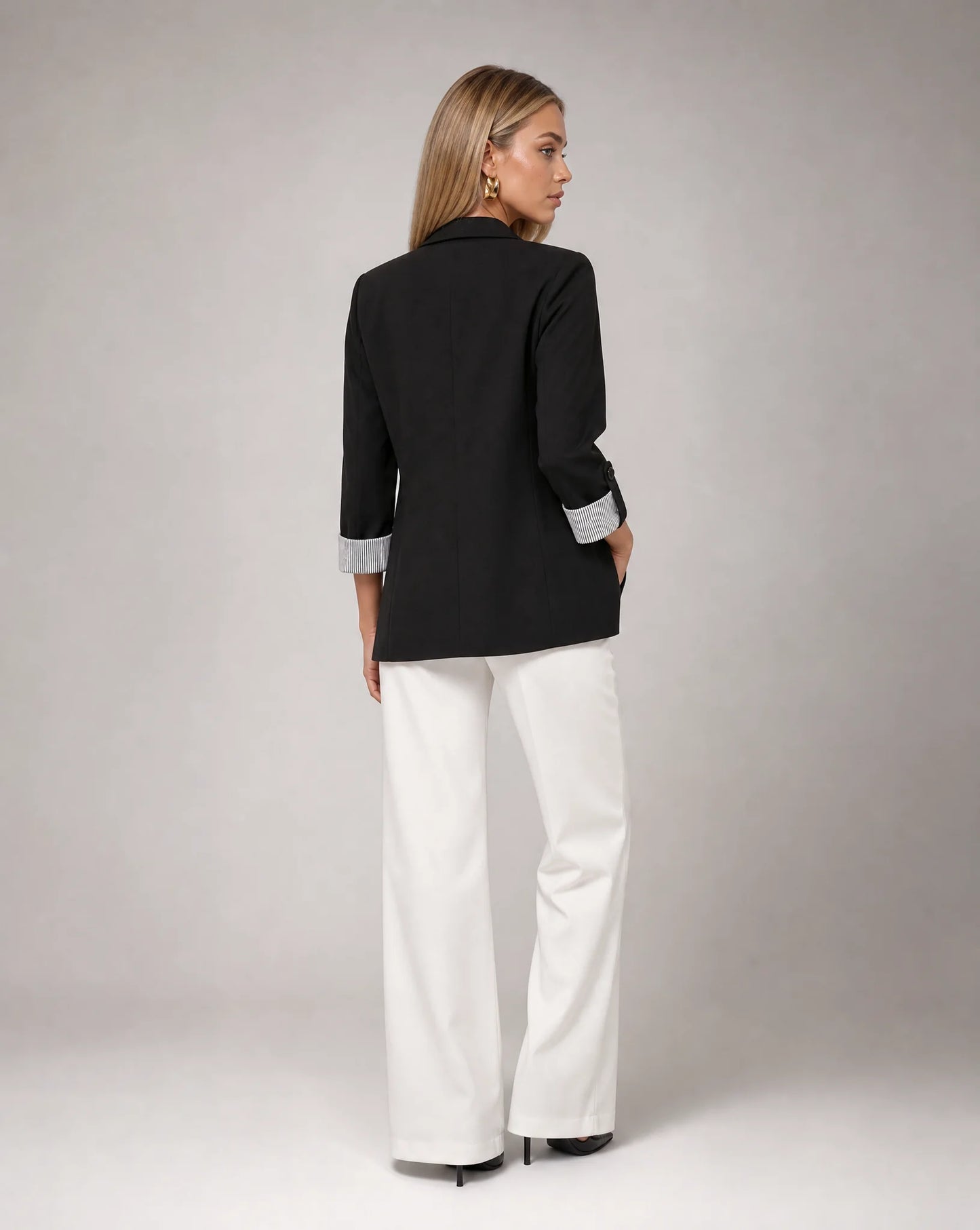 Women's black longline blazer with tailored fit and versatile everyday elegance by ILYNORA