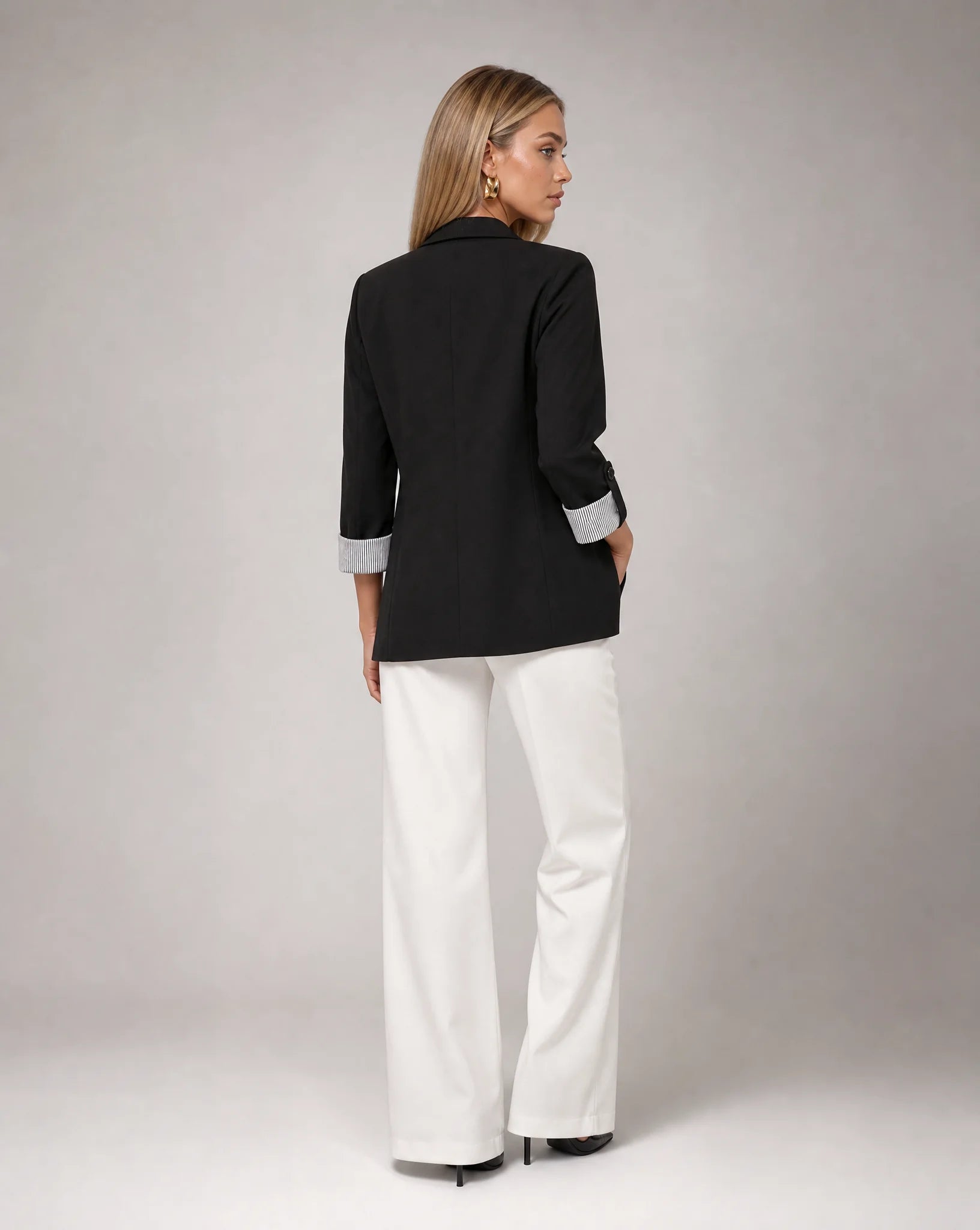 Women's black longline blazer with tailored fit and versatile everyday elegance by ILYNORA