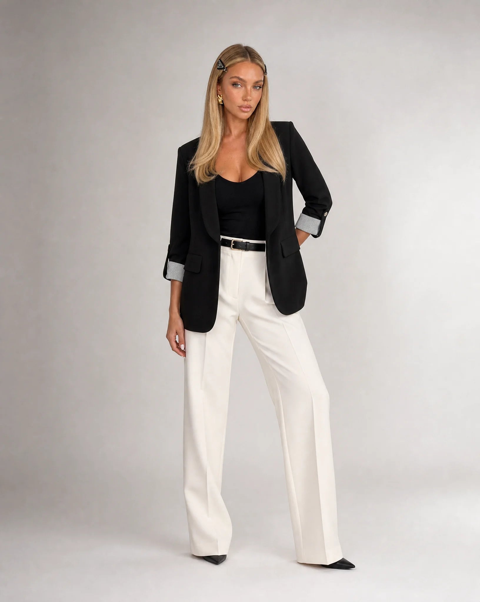Women's black tailored blazer styled with trousers for sophisticated office wear by ILYNORA