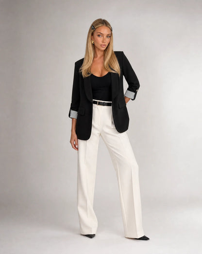 Women's black tailored blazer styled with trousers for sophisticated office wear by ILYNORA