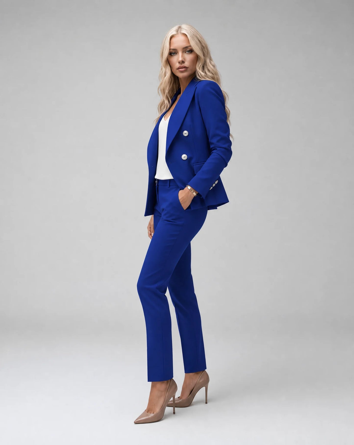 Blue tailored pantsuit side view with fitted trousers and sophisticated formal wear by ILYNORA