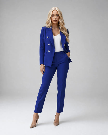 Blue tailored two piece pantsuit with double breasted blazer and elegant business styling by ILYNORA