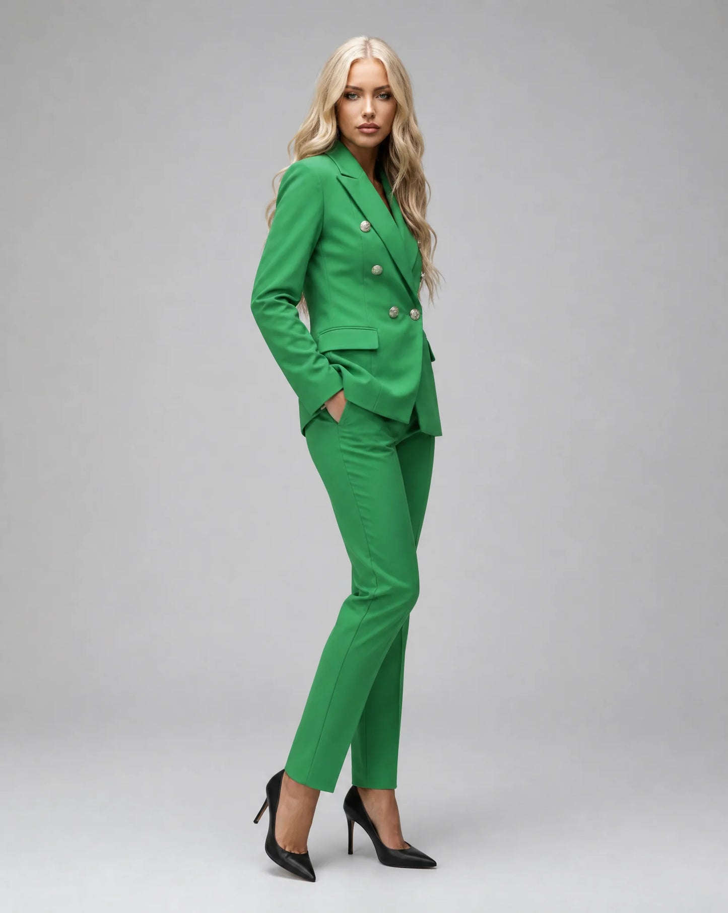 Green tailored pantsuit side view with double breasted blazer and modern silhouette by ILYNORA