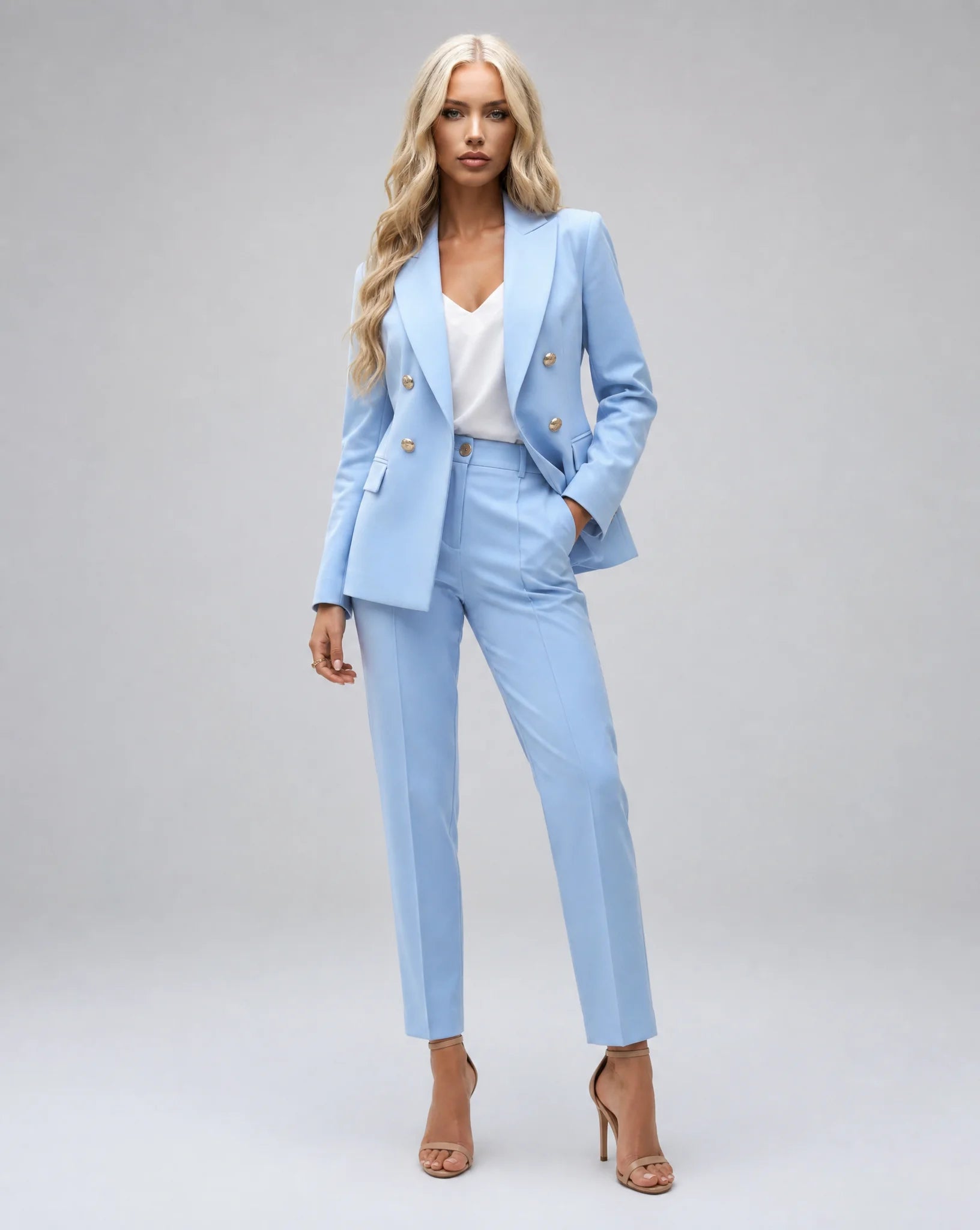 Light blue tailored two piece pantsuit with double breasted blazer and elegant office styling by ILYNORA