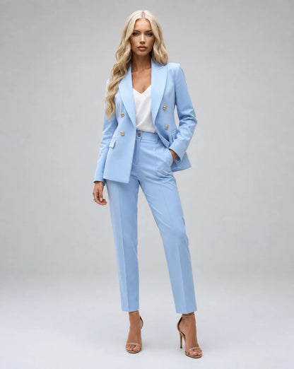 Light blue tailored two piece pantsuit with double breasted blazer and elegant office styling by ILYNORA