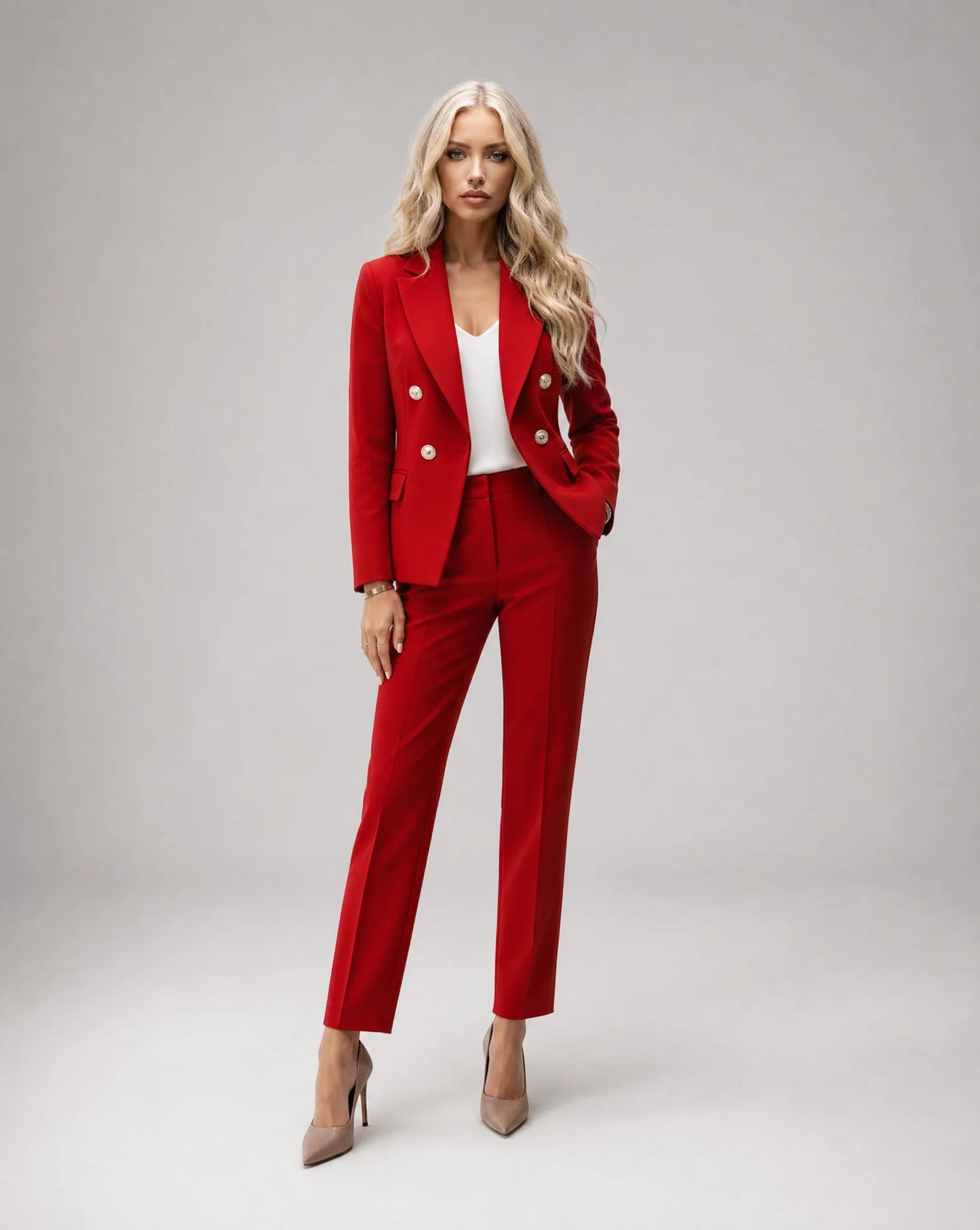 Red tailored two piece pantsuit with fitted blazer and bold occasion wear styling by ILYNORA