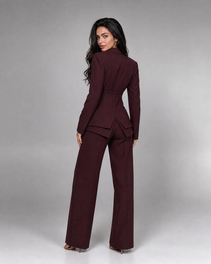 Wine red tailored two piece wide leg suit with structured blazer and matching trousers by ILYNORA