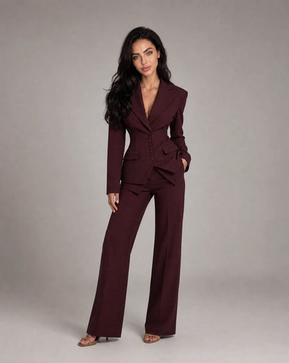 Wine red tailored two piece wide leg suit with fitted blazer and elegant formal styling by ILYNORA
