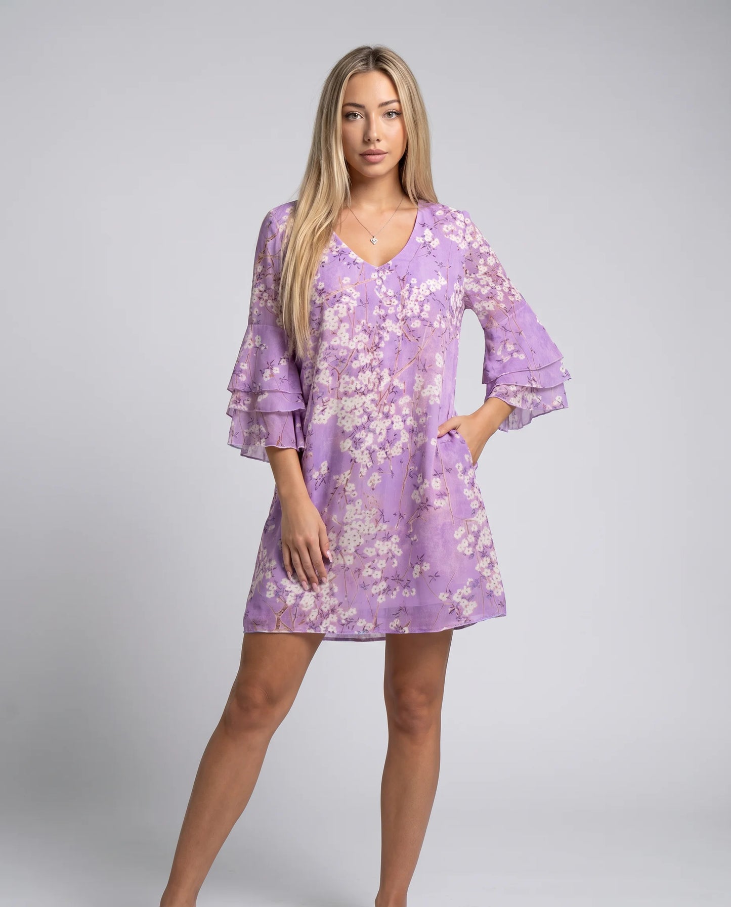Purple V-neck A-line mini dress with geometric print and relaxed summer silhouette by ILYNORA