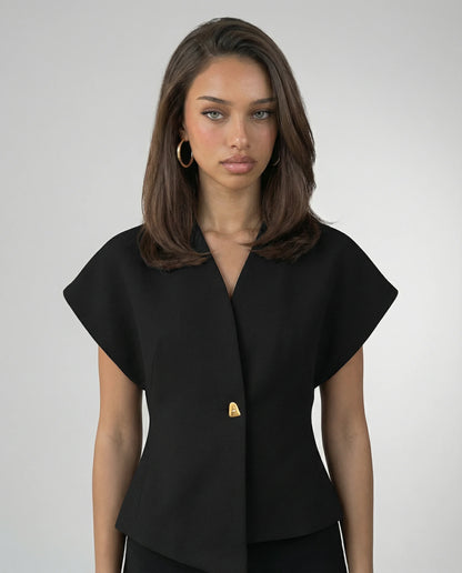 Black V-neck blouse for women by Ilynora, front view with clean tailored silhouette and button detail