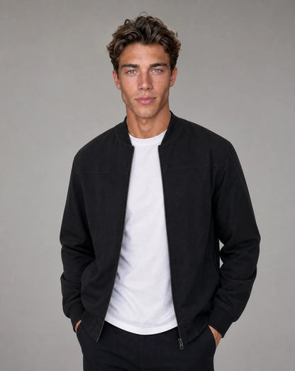 Black zip up bomber jacket for men by Ilynora, front view with ribbed collar and clean modern fit
