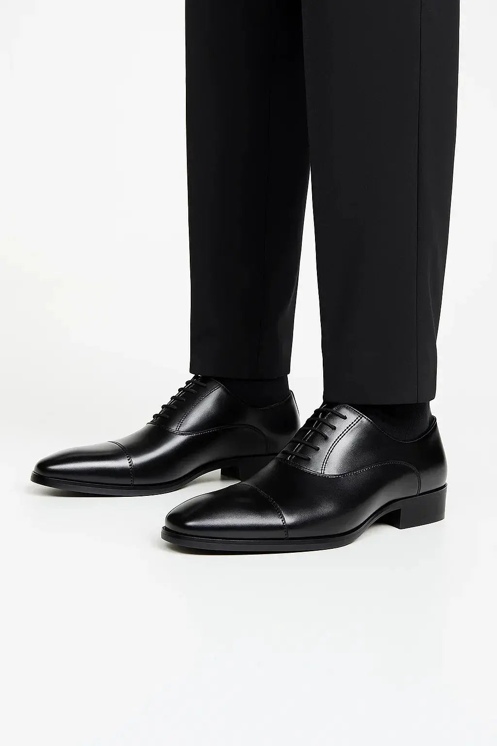 Men's black leather derby dress shoes with classic cap toe, lace-up closure and polished formal finish by ILYNORA