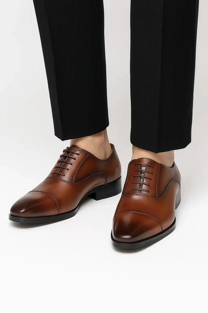 Men's brown leather derby dress shoes with genuine leather upper, cap toe and classic lace-up design for formal occasions by ILYNORA