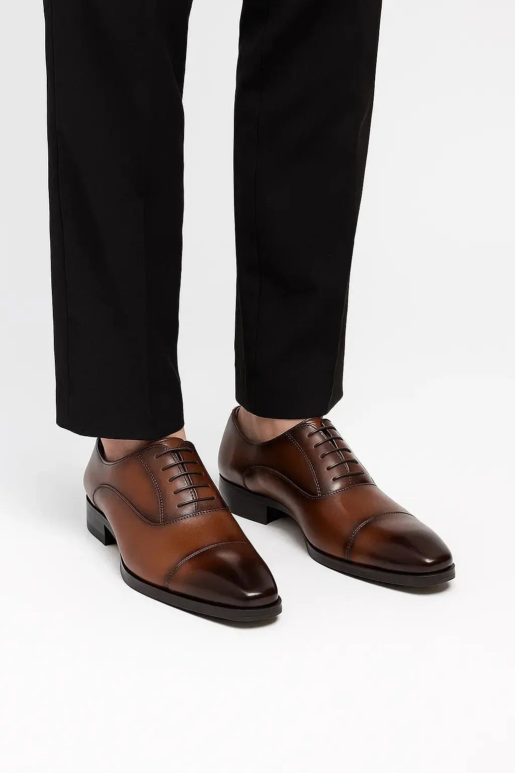 Front view of men's brown leather derby dress shoes with polished finish, timeless cap toe and refined smart formal styling by ILYNORA
