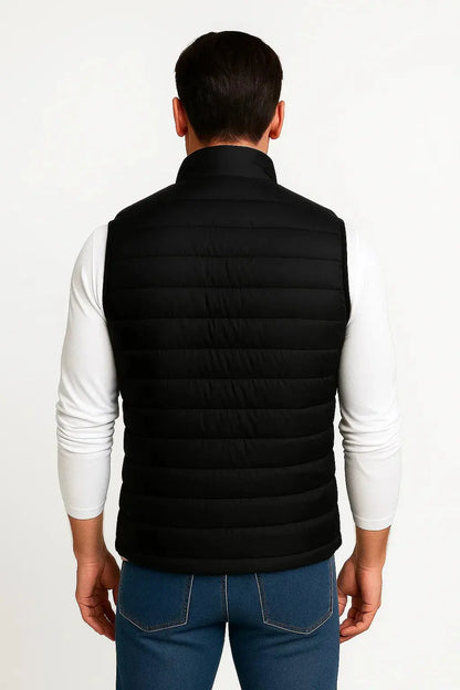 Back view of men's black lightweight quilted puffer vest with quilted padding, modern fit and stand collar by ILYNORA
