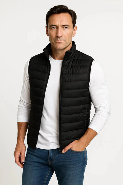 Men's black lightweight quilted puffer vest with stand collar, zip fastening and insulated sleeveless design by ILYNORA