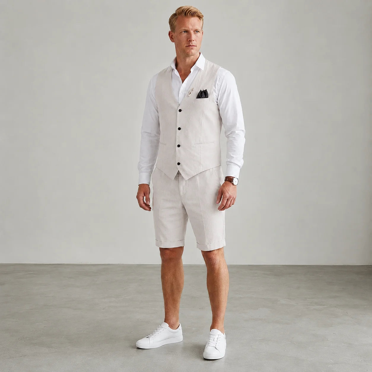 Men's beige linen waistcoat and tailored shorts set with white shirt, breathable summer tailoring for weddings and holidays by ILYNORA