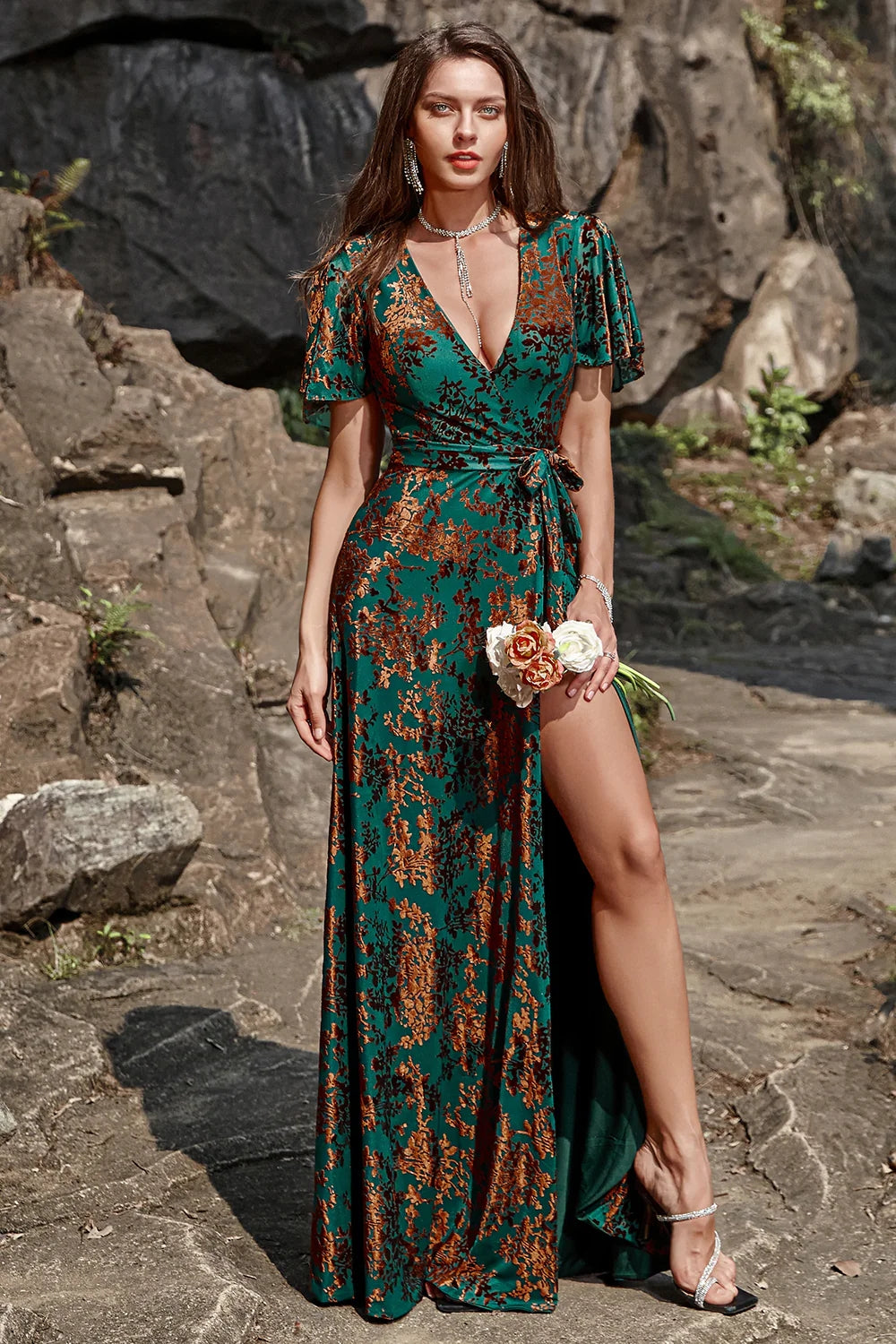 ILYNORA dark green burnout velvet wrap maxi dress, model wearing gown outdoors