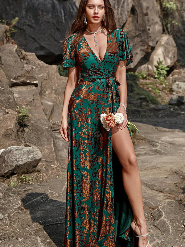 ILYNORA dark green burnout velvet wrap maxi dress, model wearing gown outdoors