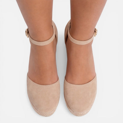 Women's beige closed toe espadrille wedges with elegant ankle strap, cushioned wedge sole and timeless summer style by ILYNORA