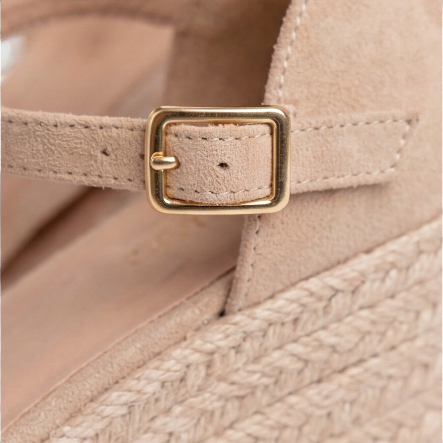 Close-up of women's beige closed toe espadrille wedges with gold buckle, soft suede upper and braided jute sole by ILYNORA