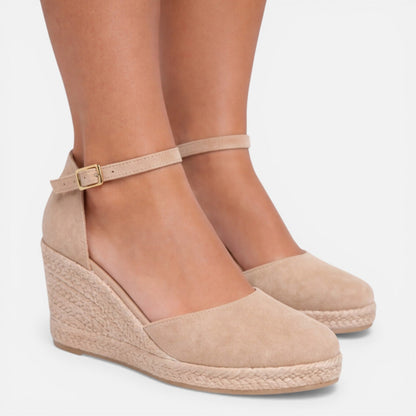 Women's beige closed toe espadrille wedges with suede upper, ankle strap and woven jute wedge heel by ILYNORA