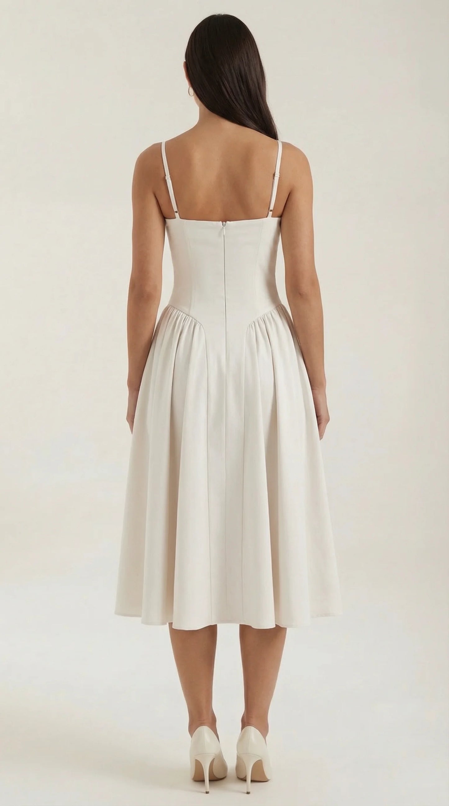 Back view of women's off white corset fit and flare midi dress with flattering fitted waist and midi skirt by ILYNORA